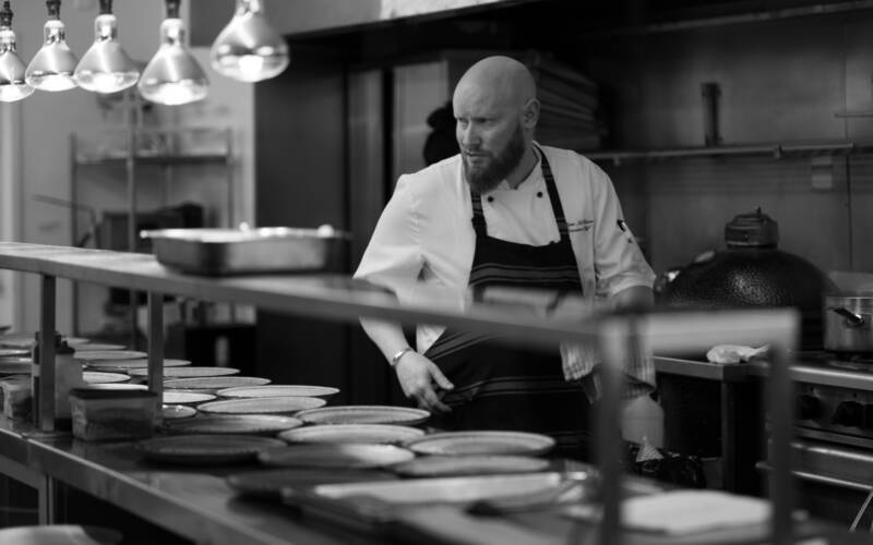 Executive Chef Ryan McKenzie in full concentration mode behind the scenes during the 2025 Sakura and Sake Dinner