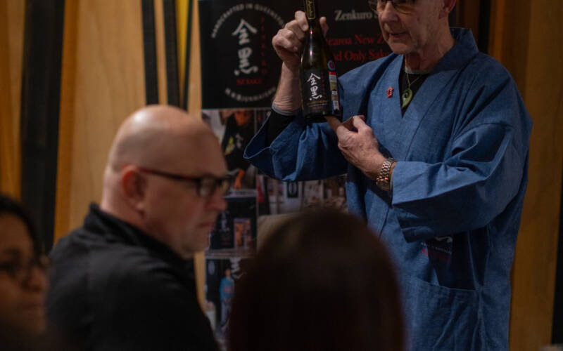 David Joll, Brewer from Zenkuro Sake speaks about the Aoraki Junmai Daiginjo served alongside amuse bouche course at the 2025 Sakura and Sake Dinner in Pescatore - one of the private dining venues of The George hotel.