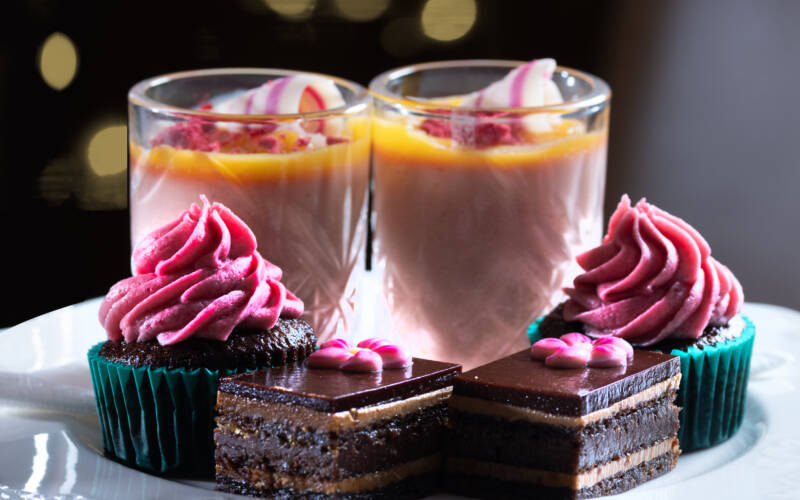 High tea black forest cupcake with cherry icing, strawberry panna cotta, lemon curd and opera slice