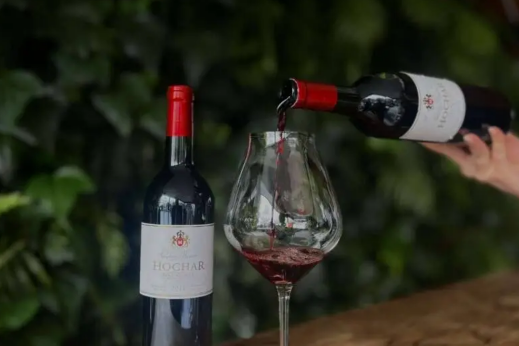 Red wine being poured from the extensive wine list at 50 Bistro.